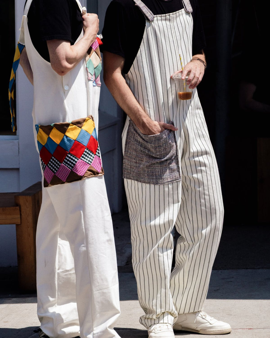 PickPocket pinstripe overalls with a grey patch pocket, on a New York sidewalk